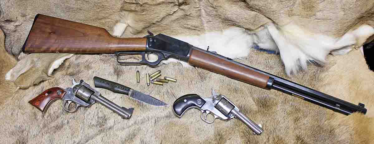 The Marlin 1894 rifle in .32 H&R Magnum along with the .327 Magnum Ruger Single-Seven revolvers. The knife is a custom Damascus blade by James Rodebaugh.